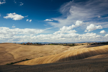 Rolling hills in autumn after harvest.