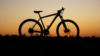 Fototapeta na wymiar silhouette of bicycle on sunset