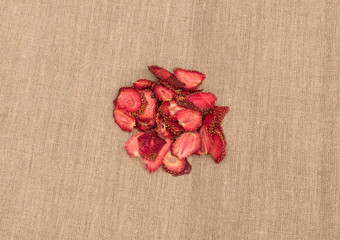 Dehydrated Dry Strawberries on Rustic Burlap Background