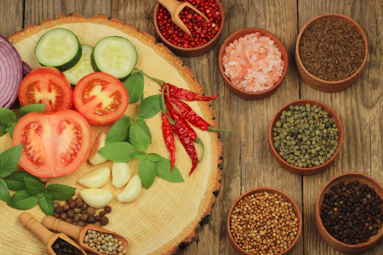 vegetables and spices on wooden background. top view