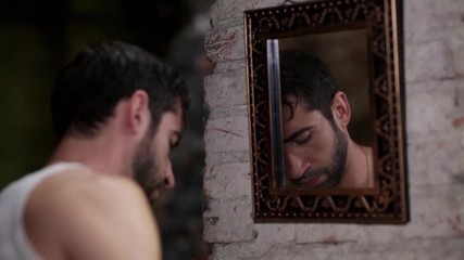 Serious boy shaving his beard