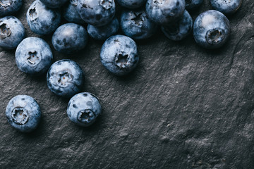 Fresh blueberry background. Texture blueberry berries close up. Vegan and vegetarian concept.