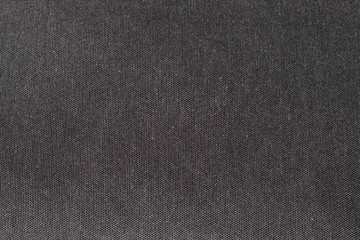Fototapeta na wymiar Dark gray fabric texture closeup