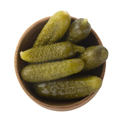heap pickled cucumber in wooden plate  isolated on white background. top view