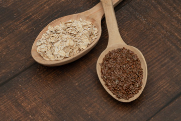 Seeds on a wooden spoon close up