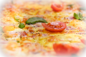 fresh tomato and greens on pizza