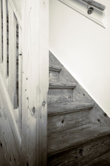 Clean and new wooden staircase in modern home interior close-up