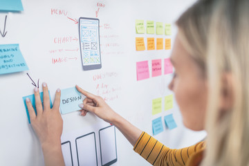 Designers drawing website ux app development.