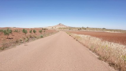 secondary paved road on a summer landscape next to Magacela, province of Badajoz, Extremadura, Spain
