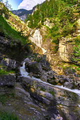 Fototapeta na wymiar Die Kuhfluchtwasserfälle, eine Gruppe von drei Wasserfällen oberhalb von Farchant in Bayern. The Kuhflucht Waterfalls in south Bavaria, a beautiful series of three waterfalls near the Bavarian alps.
