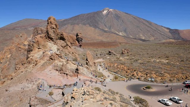 Hyper lapse of people hiking on Los Roques de Garcia rocks near the Teide volcano, Teide National Park, Tenerife, Canary islands, Spain.