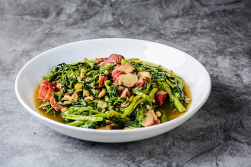 Fried water spinach with barbecued red pork
