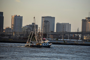 Fototapeta na wymiar new orleans skyline with trawlboat