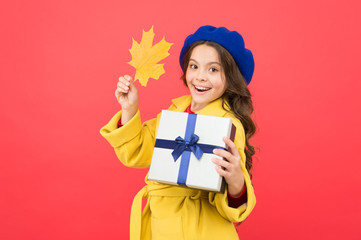 Just having fun. thanksgiving day. fall season. school shopping sales. happy small girl with maple leaf and present box. autumn kid fashion. girl child in french beret hold gift. Autumn weather
