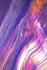 Abstract created using the technique of liquid acrylic. Macro photography of the smallest details of a picture. The picture shows how overflows of shades and colors of paint resemble space motifs.