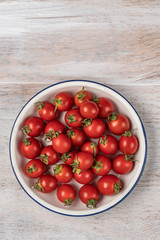 ripe cherry tomatoes on a wooden table