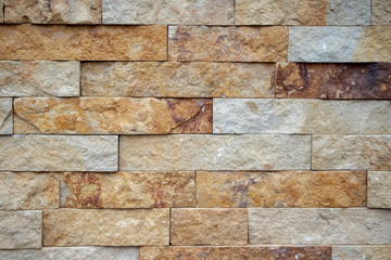 wall of yellow embossed sandstone