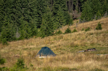Tent in the meadow in the mountains