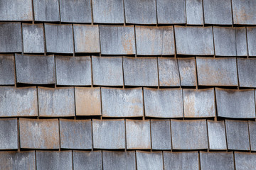 Wooden tiles or shingles typical of the northwestern pacific coast: wooden texture and geometrical patterns