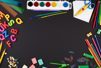 school supplies: multicolored wooden pencils, paper stickers, paper clips