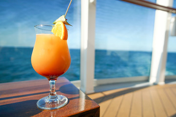 tequila sunrise watching the oceans blue on a cruise ship
