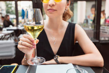 young asian customer drinking white wine