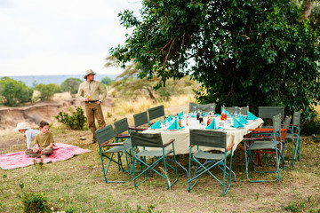 Family on safari bush lunch © TravelPhotoBloggers