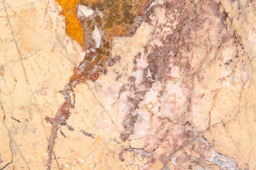 Cracked antique light yellow and red marble texture and background. Rough natural antique rock texture.