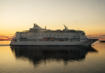 Fototapeta na wymiar Passenger ferry against a sunset in the Baltic sea.