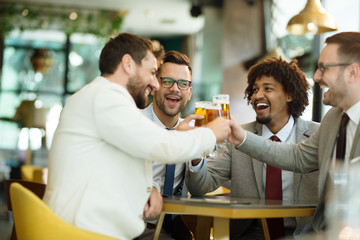 young businessmen after work in a pub
