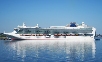 Huge white cruise ship moored in the port.