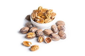 Fototapeta na wymiar Organic pecan nuts on a white background