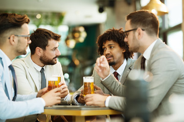 young businessmen after work in a pub