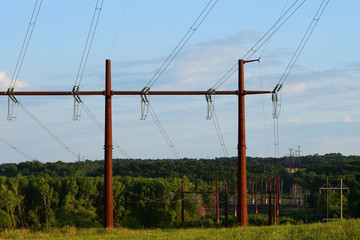 electric power lines and pylons in field