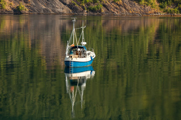 Small beautiful boat in a lake or in a large river
