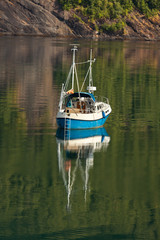 Small beautiful boat in a lake or in a large river