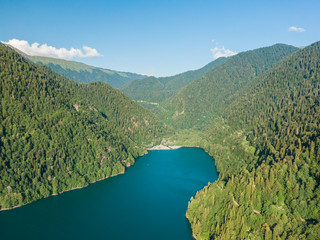 Fototapeta na wymiar Stunning mountain landscape with a crystal clear blue lake. Aerial view