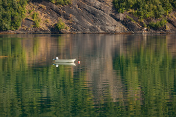Small beautiful boat in a lake or in a large river