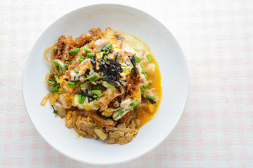 Japanese traditional food, Tonkatsu deep-fried pork cutlet on top with eggs