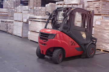 Fototapeta na wymiar Forklift loader in storage warehouse ship yard. Distribution products. Delivery. Logistics. Transportation. Business background
