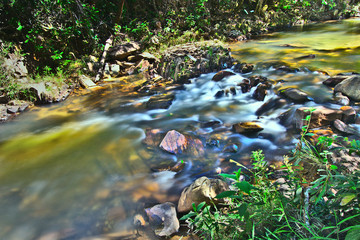 PIRENOPOLIS, BRAZIL - JULY 07, 2019: Brazilian people have fun in waterfall on July, 2019 Pirenopolis, Brazil.