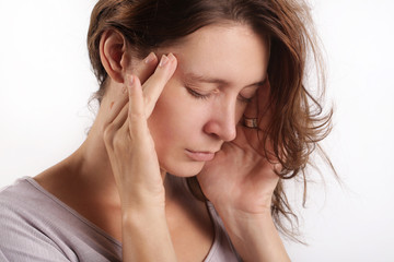 Fototapeta premium Studio shot of a young woman suffering from headache