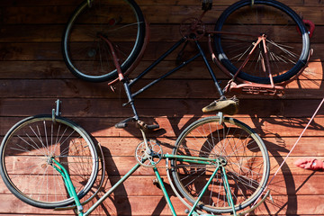 Fototapeta na wymiar Old iron bicycles close up. Interior decoration