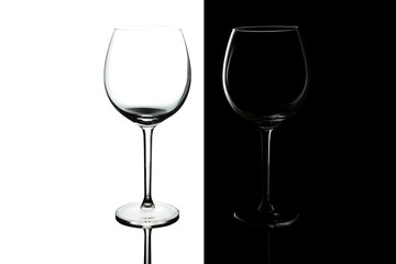 Clean Empty wine glasses with reflections on black and white background. Alcohol beverage card backdrop.