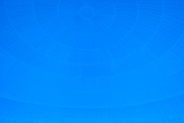 Blue background with spherical circular patterns.