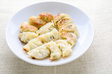 Japanese Fried Dumplings, the half moon-shaped dumplings served in Asian restaurants as an appetiser or side dish, pork and vegetable filling.