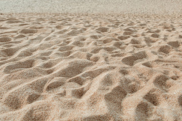 Tropical beautiful beach with white sand and foot steps. Summer travel or vacation concept.