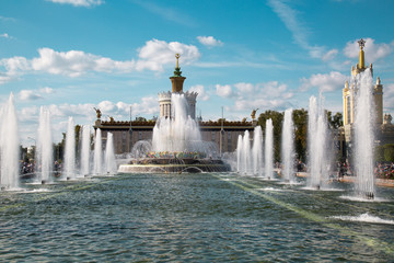 Stone flower fountain at Exhibition of achievements of the national economy (VDNH) in the contra light on a Sunny day. Moscow attractions of World tourism.