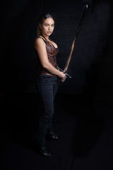 Young woman in urban fantasy style poses