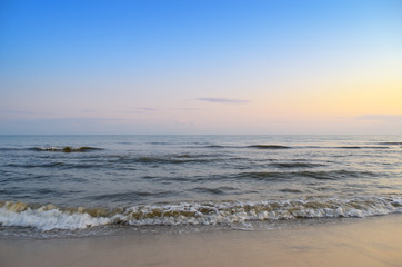Fototapeta na wymiar Panorama of sea waves on the background of dawn